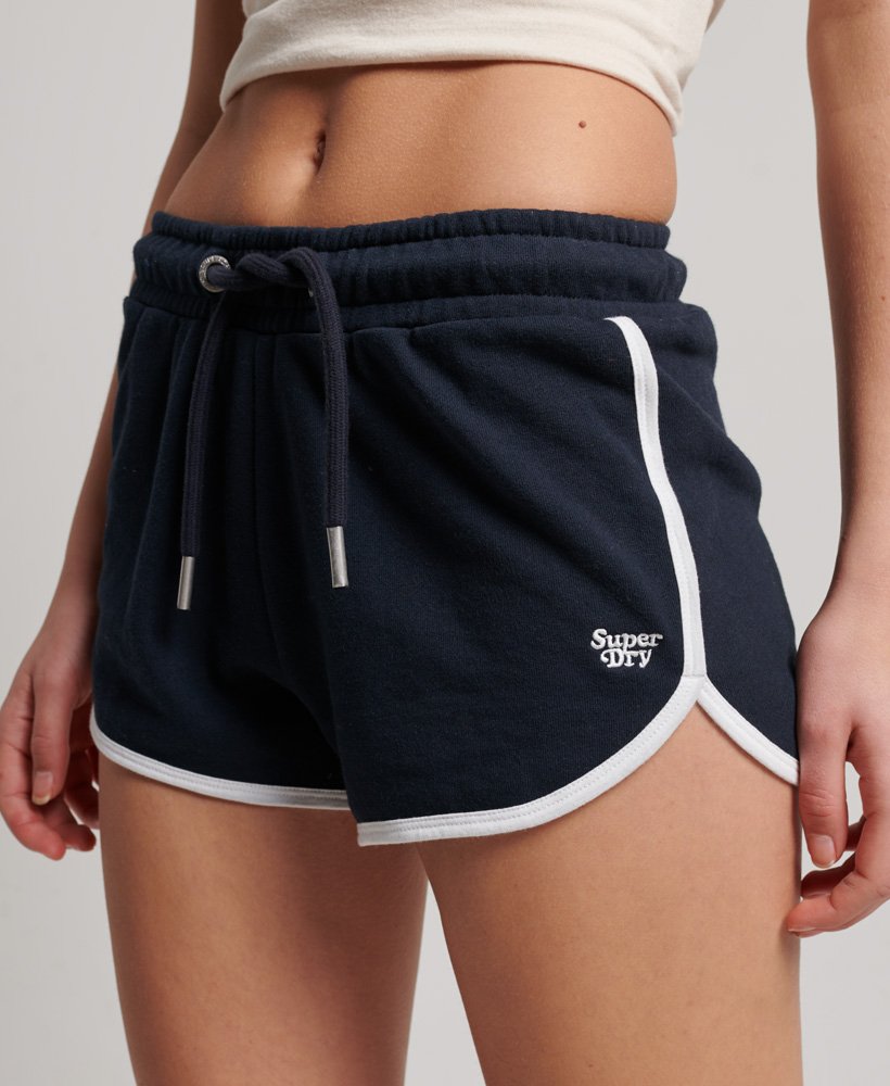 shorts de corrida vintage em malha na cor azul marinho eclipsebranco óptico.