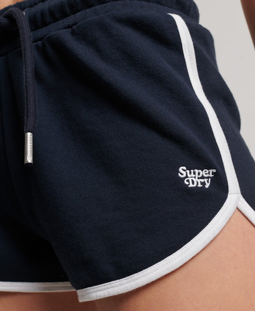 shorts de corrida vintage em malha na cor azul marinho eclipsebranco óptico.