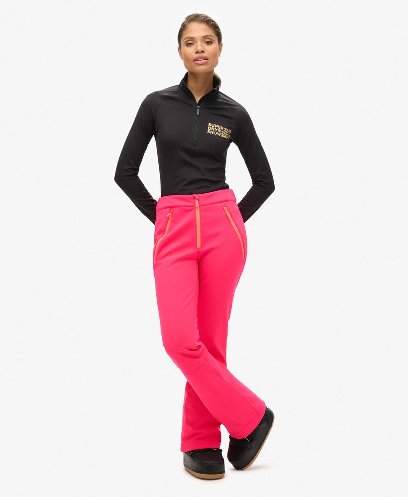 calças de esqui slim em softshell na cor rosa vibrante.