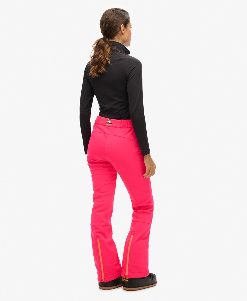 calças de esqui slim em softshell na cor rosa vibrante.