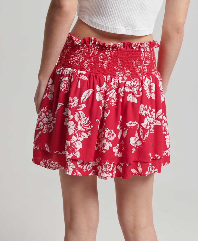 saia vintage com babados e detalhes franzidos em estampa floral vermelha.