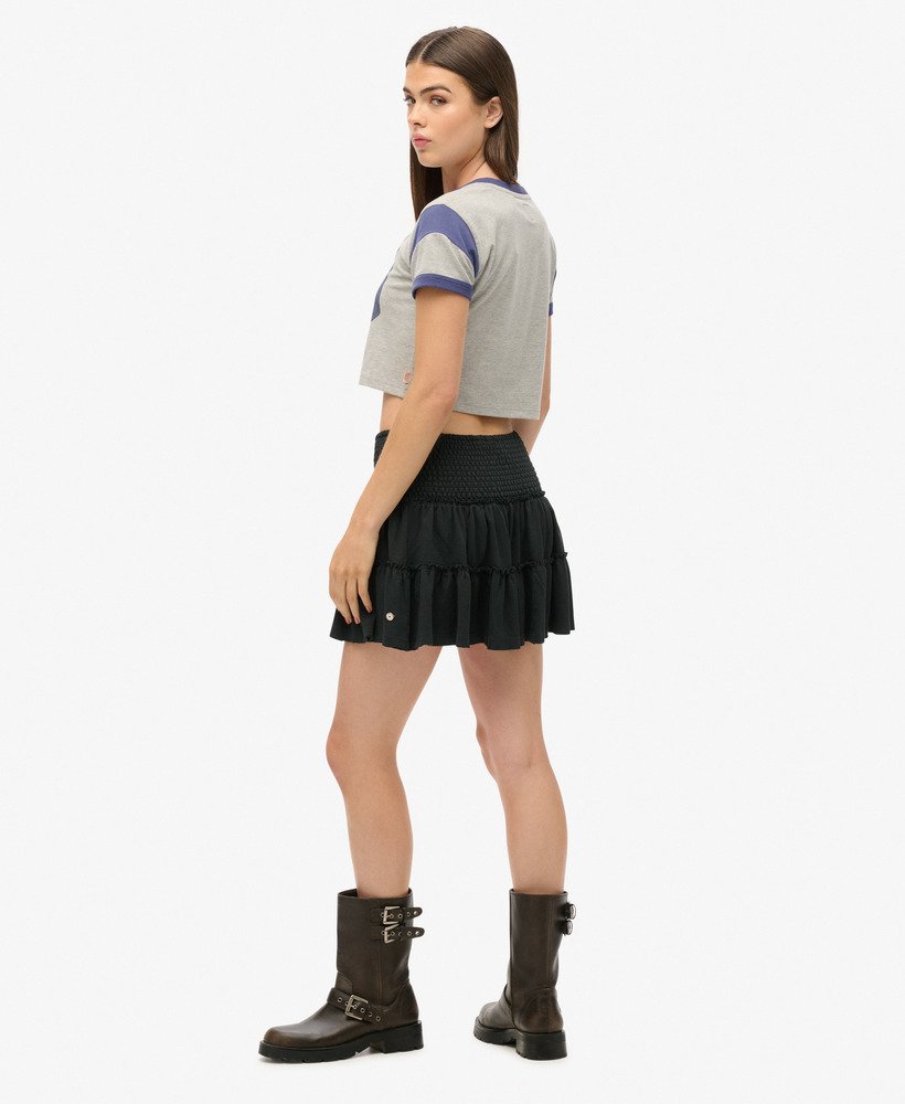minissaia de malha com camadas na cor preta
