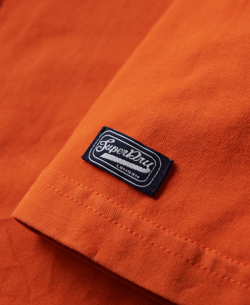 camiseta cooper com logo retrô dos anos 70 na cor laranja purê de abóbora.