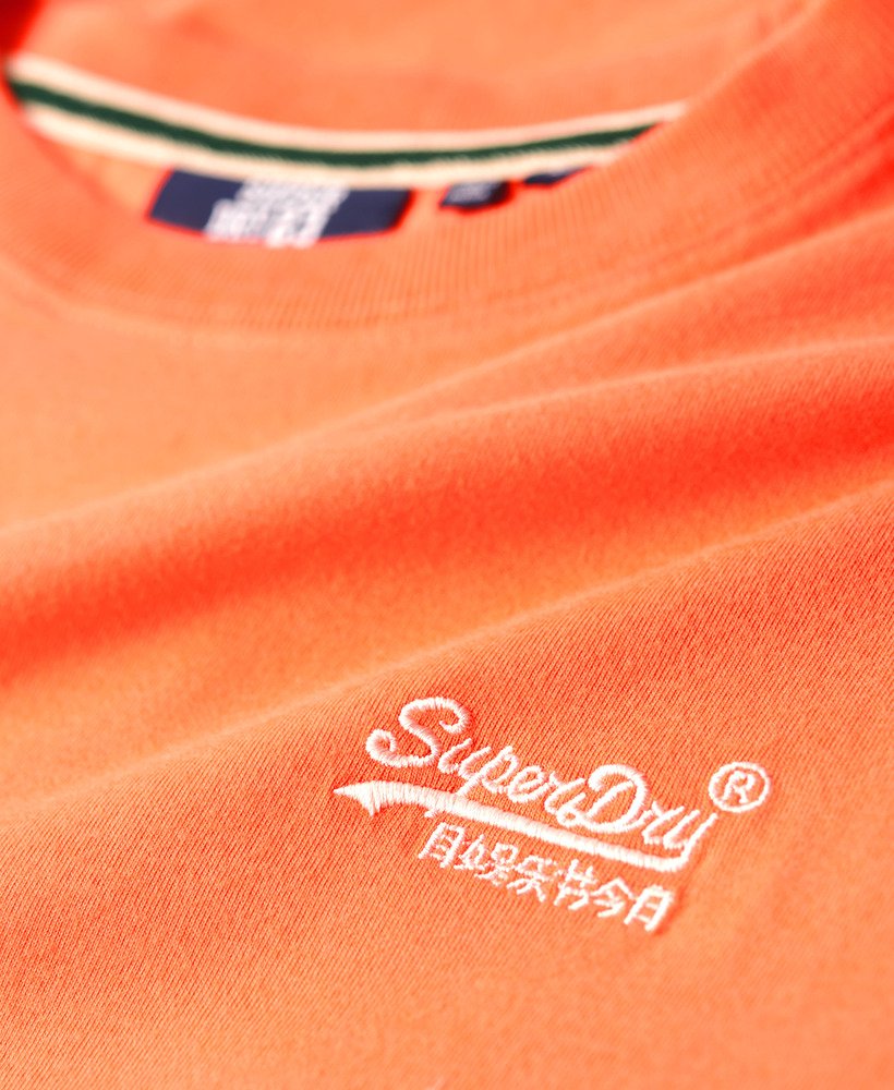 camiseta essential logo em algodão orgânico na cor coral sunburst