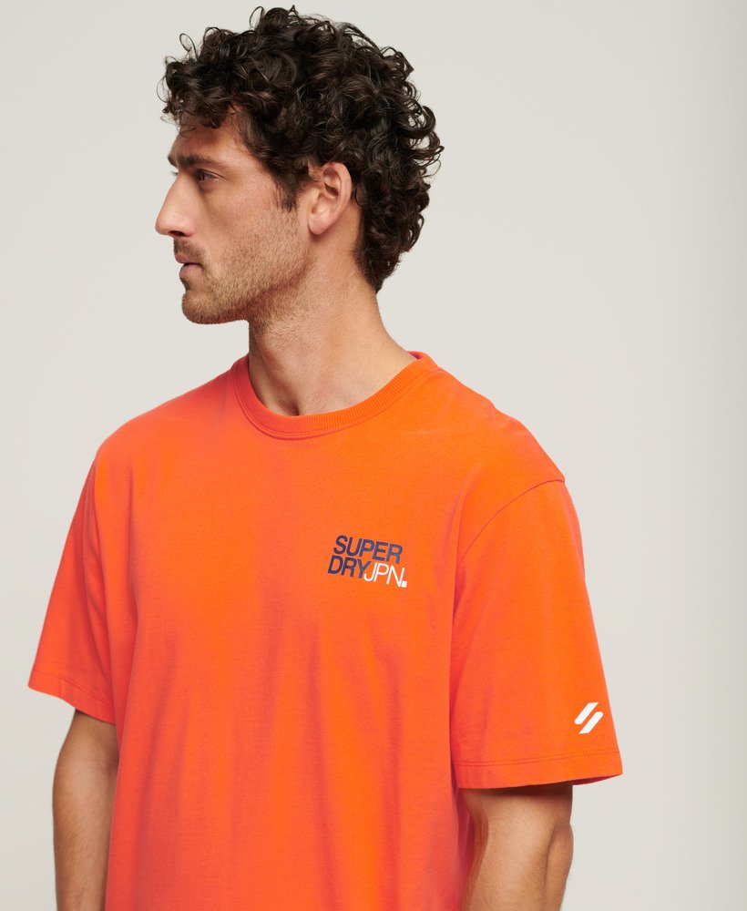 camiseta folgada com logo da sportswear na cor laranja vibrante.