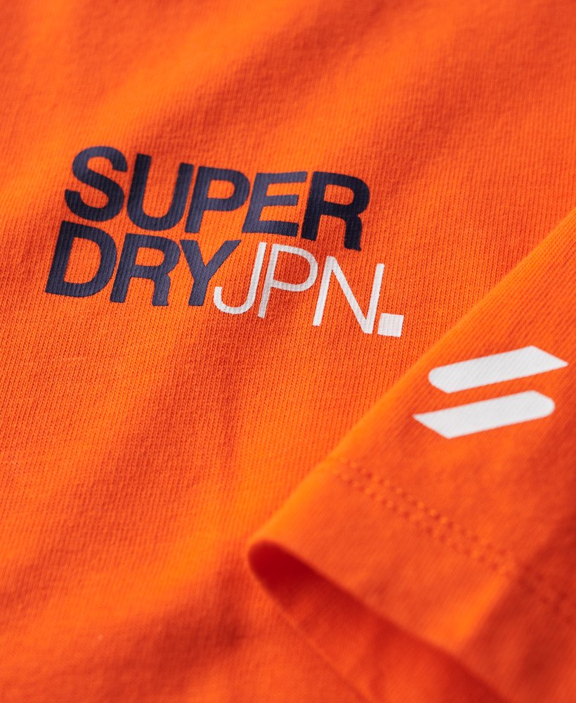 camiseta folgada com logo da sportswear na cor laranja vibrante.