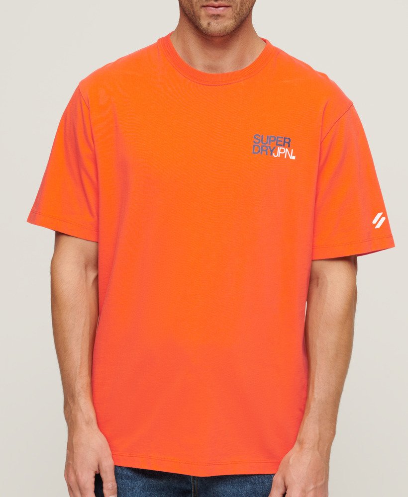 camiseta folgada com logo da sportswear na cor laranja vibrante.