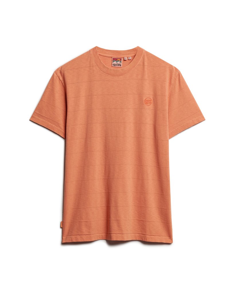 camiseta de algodão orgânico com textura vintage na cor laranja ferrugem defumada.