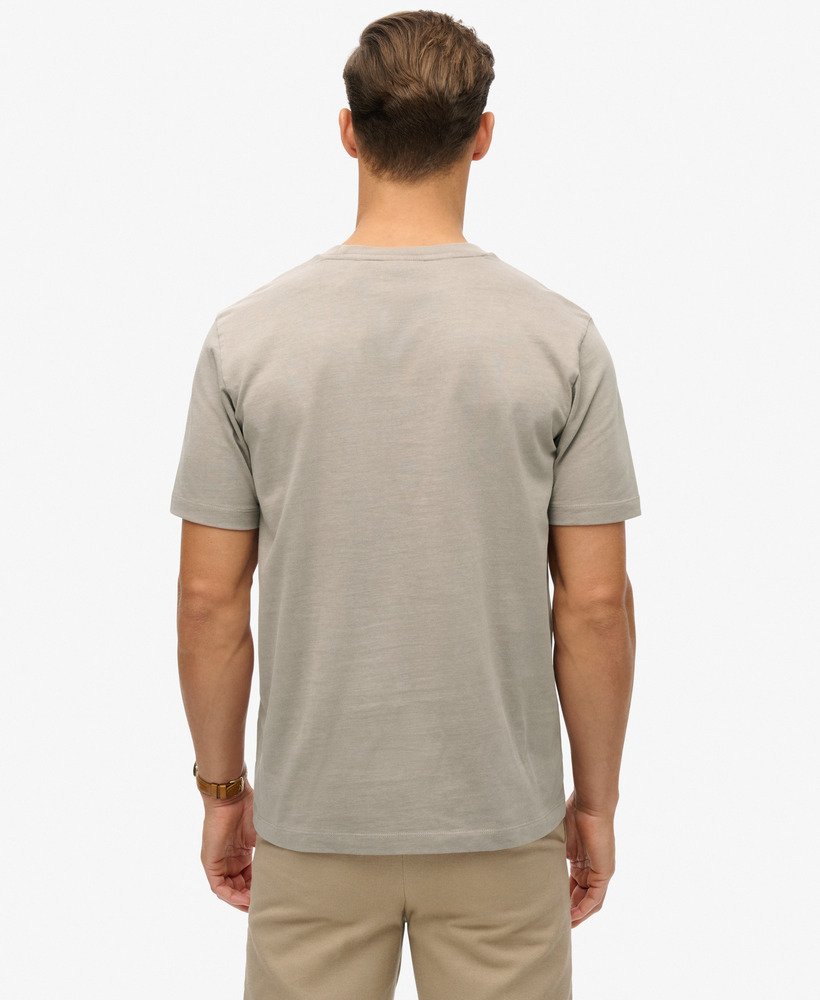 camiseta folgada com estampa de micro logo em tecido slub bege escuro.