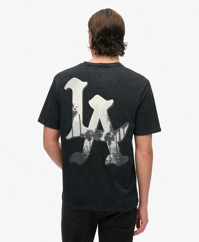camiseta folgada para skate com estampa fotográfica em preto lavado.