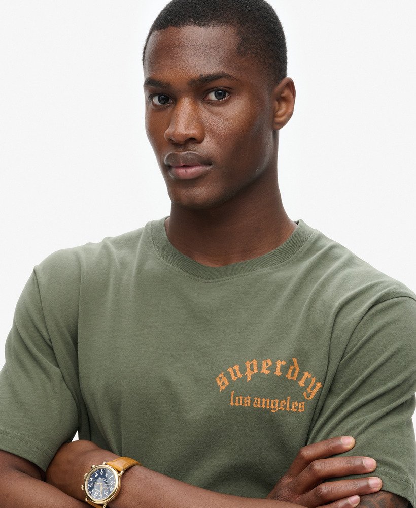 camiseta folgada com estampa de tatuagem nas costas em verde escuro