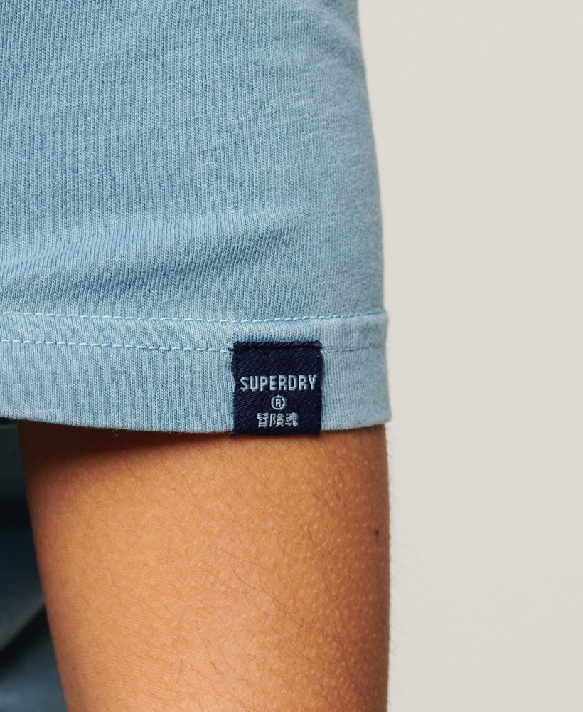 camiseta cooper classic com o logo dos anos 70 na cor azul heritage