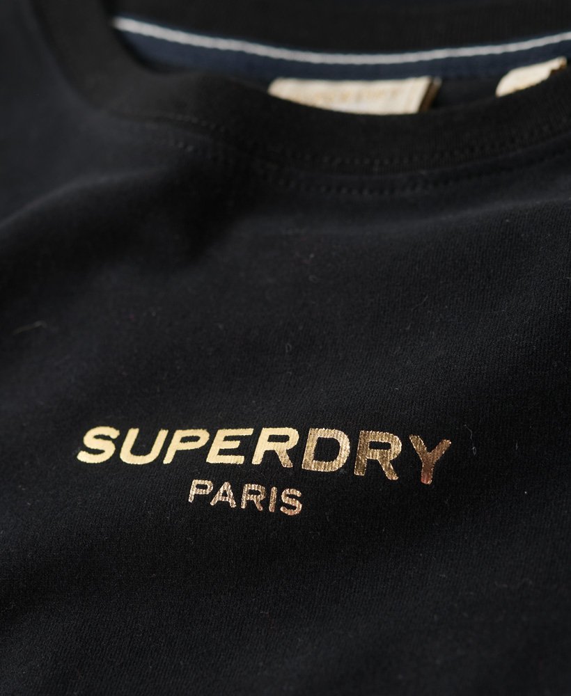 camiseta cropped sport luxe com logo na cor pretadourada.