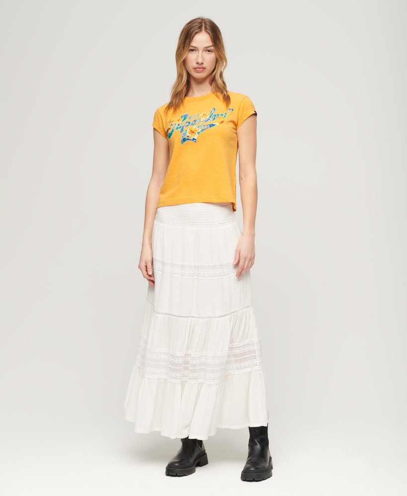 camiseta de manga curta com estampa floral em amarelo âmbar mesclado.