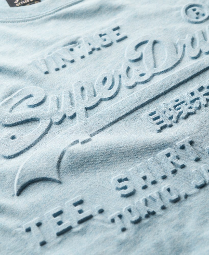 camiseta relaxed com logo vintage em relevo na cor azul mesclado