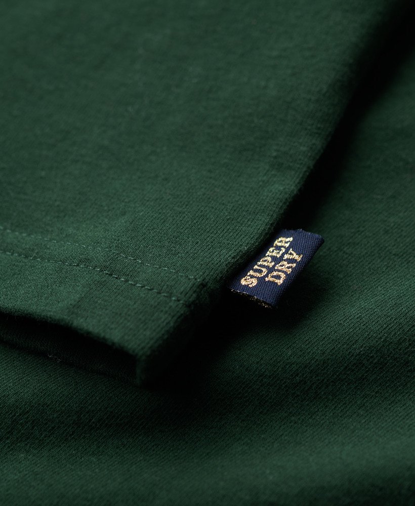 camiseta athletic essentials graphic ringer na cor verde esmalte.