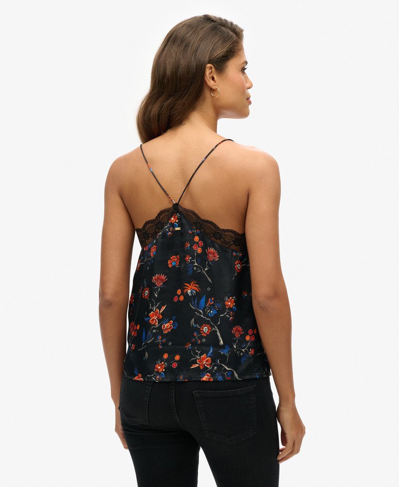 top de alças em cetim com detalhes em renda e estampa rinko preta.