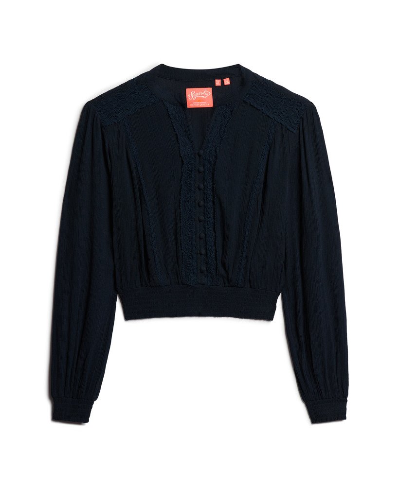 blusa de manga comprida com detalhes em renda e franzido na cor azul marinho eclipse.