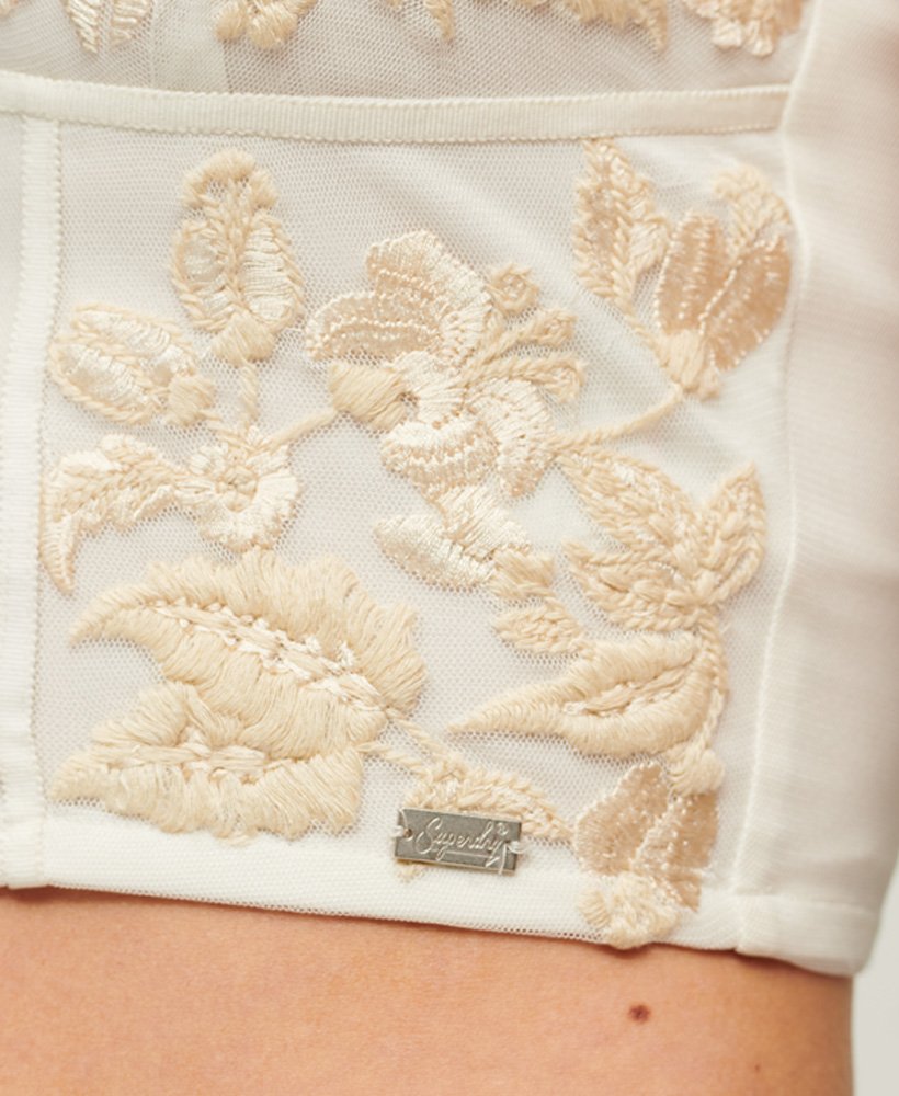top corset bordado com flores na cor creme urbano