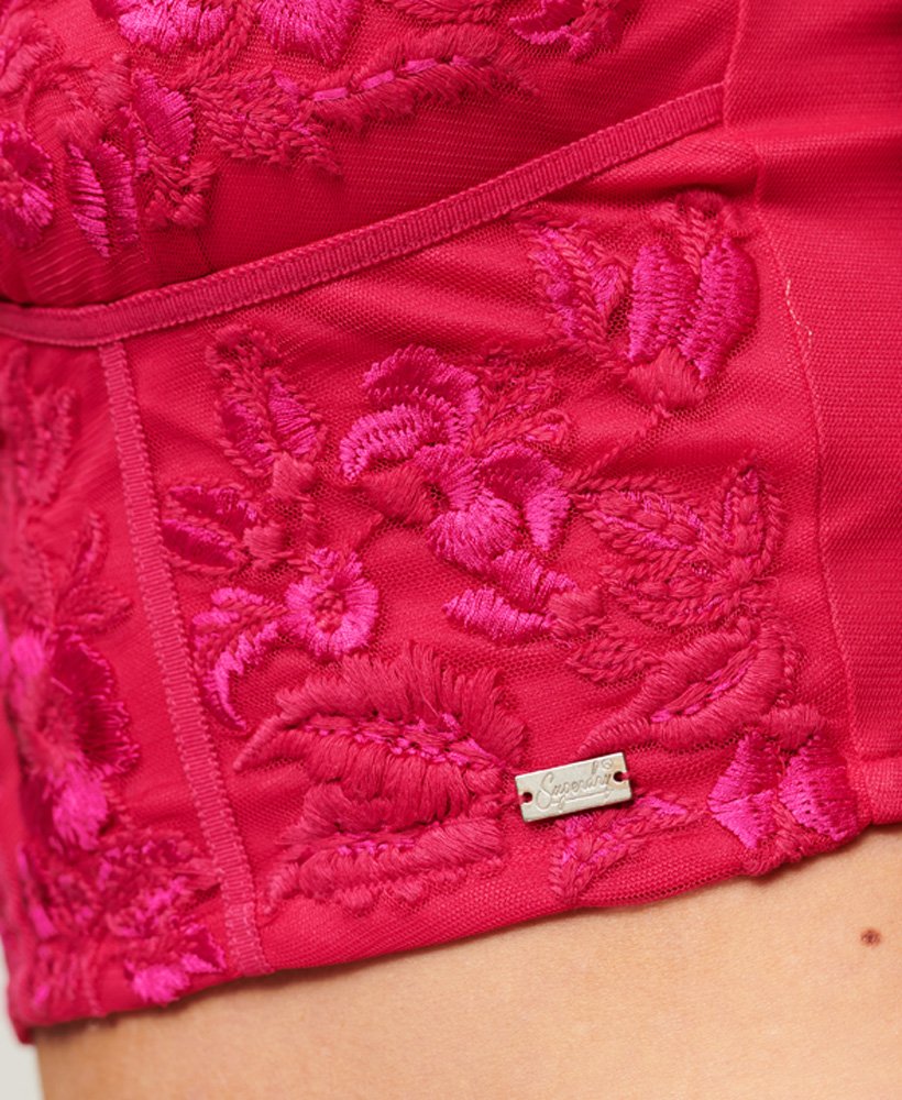 top corset bordado com flores em rosa fúcsia