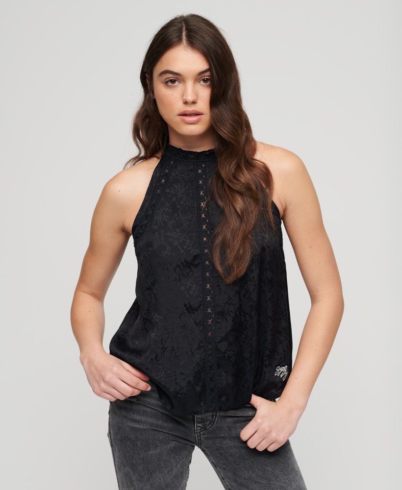 blusa sem mangas de renda com gola alta na cor preta urbana.
