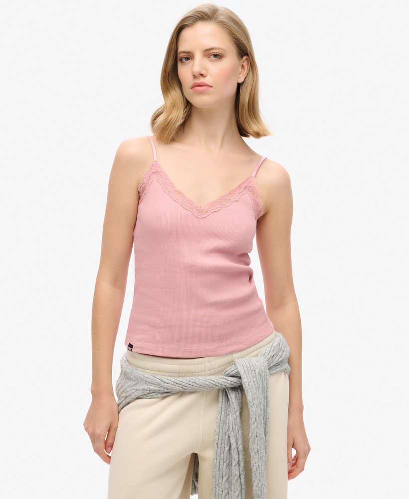 top esportivo básico com detalhes em renda na cor rosa claro.