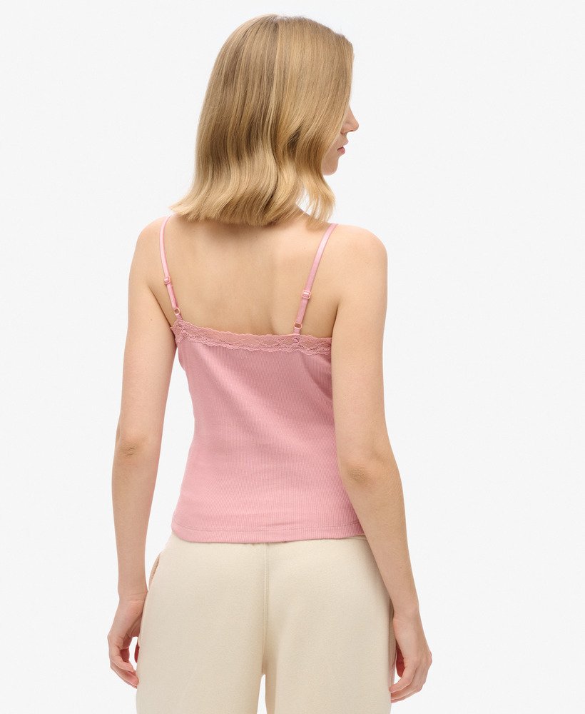 top esportivo básico com detalhes em renda na cor rosa claro.