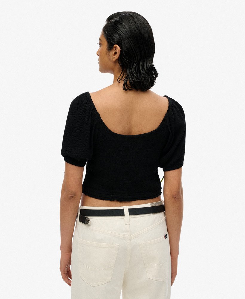 blusa de tecido plano com detalhes franzidos na cor preta.
