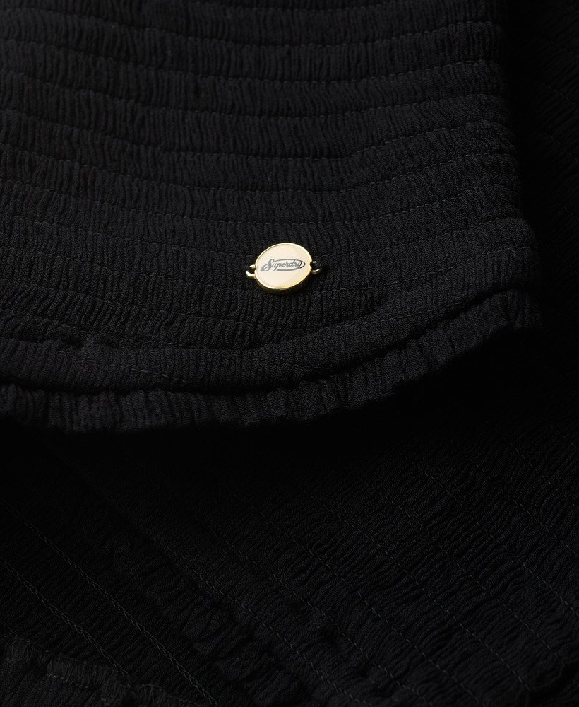 blusa de tecido plano com detalhes franzidos na cor preta.