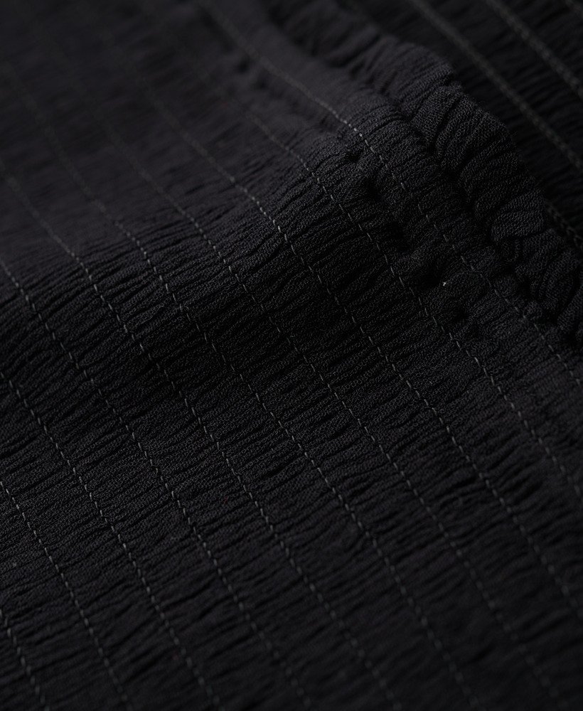 top bandeau com detalhe franzido na cor preta.
