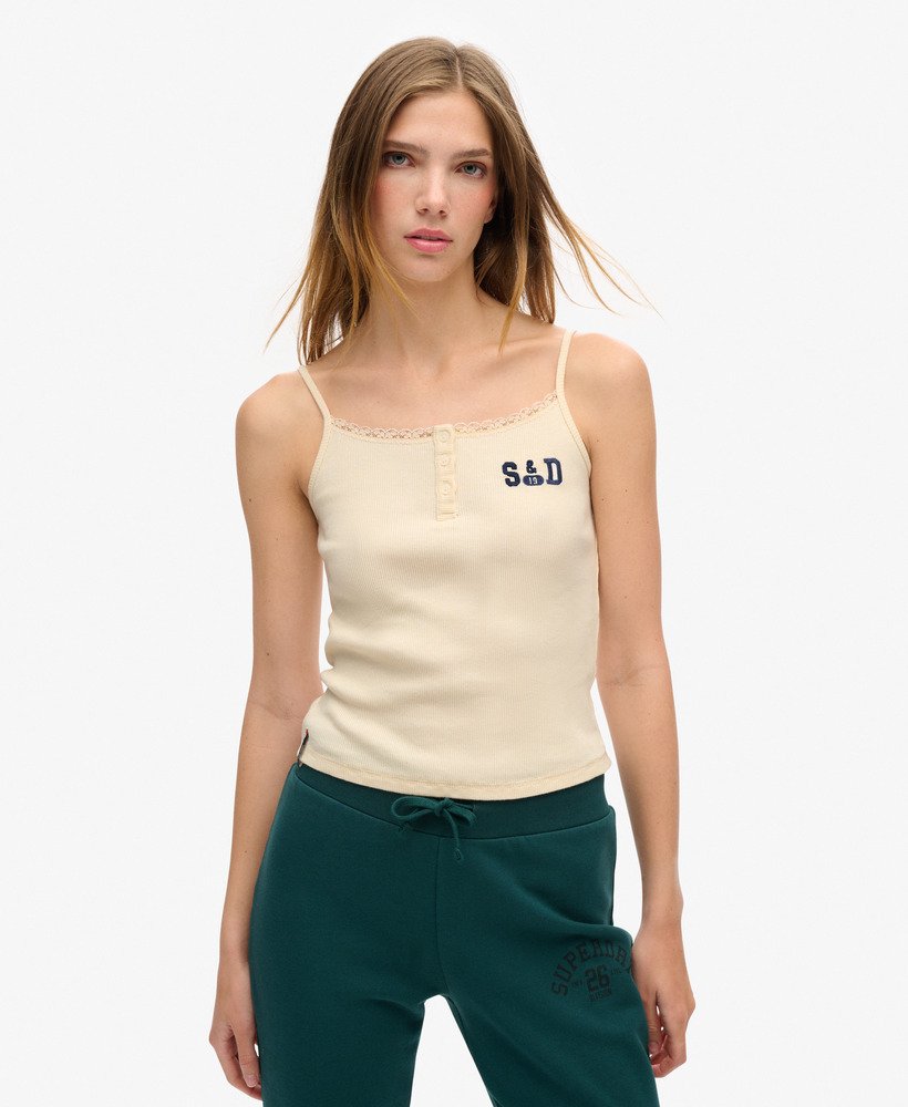 camiseta regata esportiva essencial com estampa de botões na cor creme turtledove.