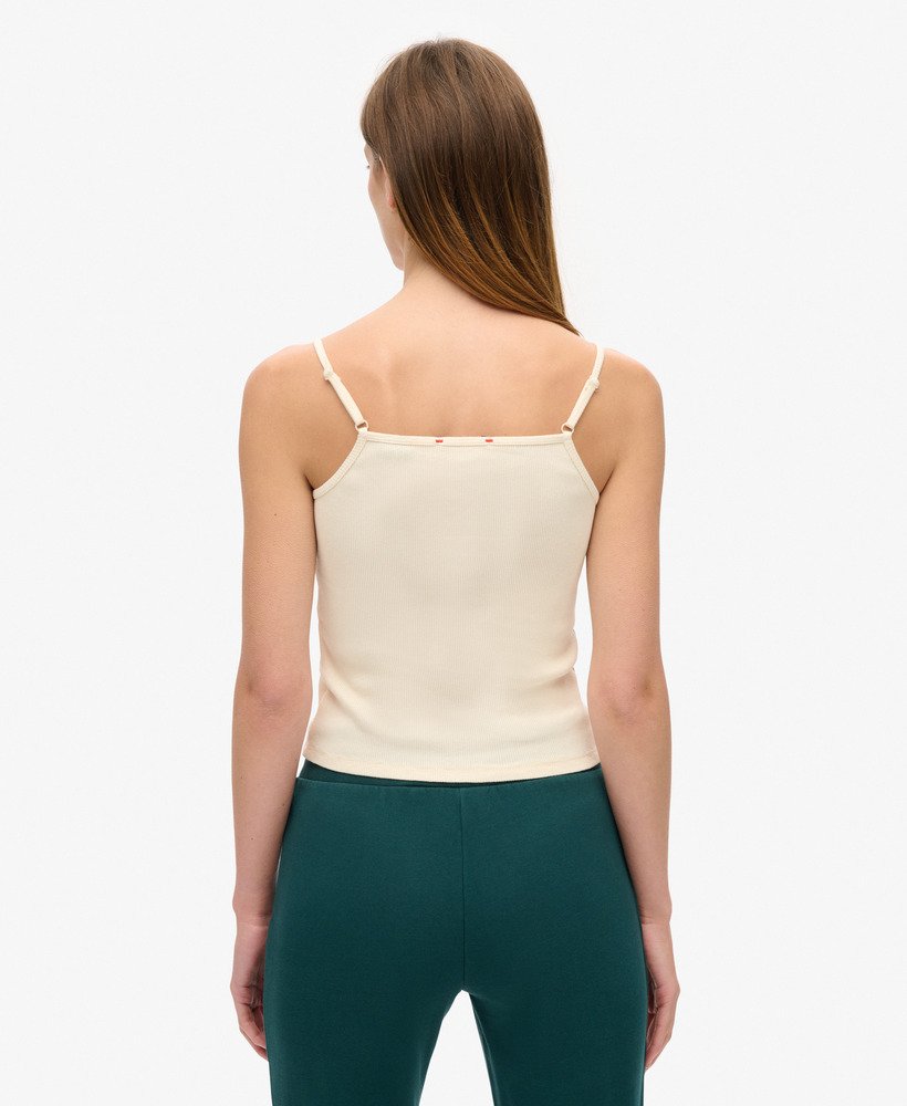 camiseta regata esportiva essencial com estampa de botões na cor creme turtledove.