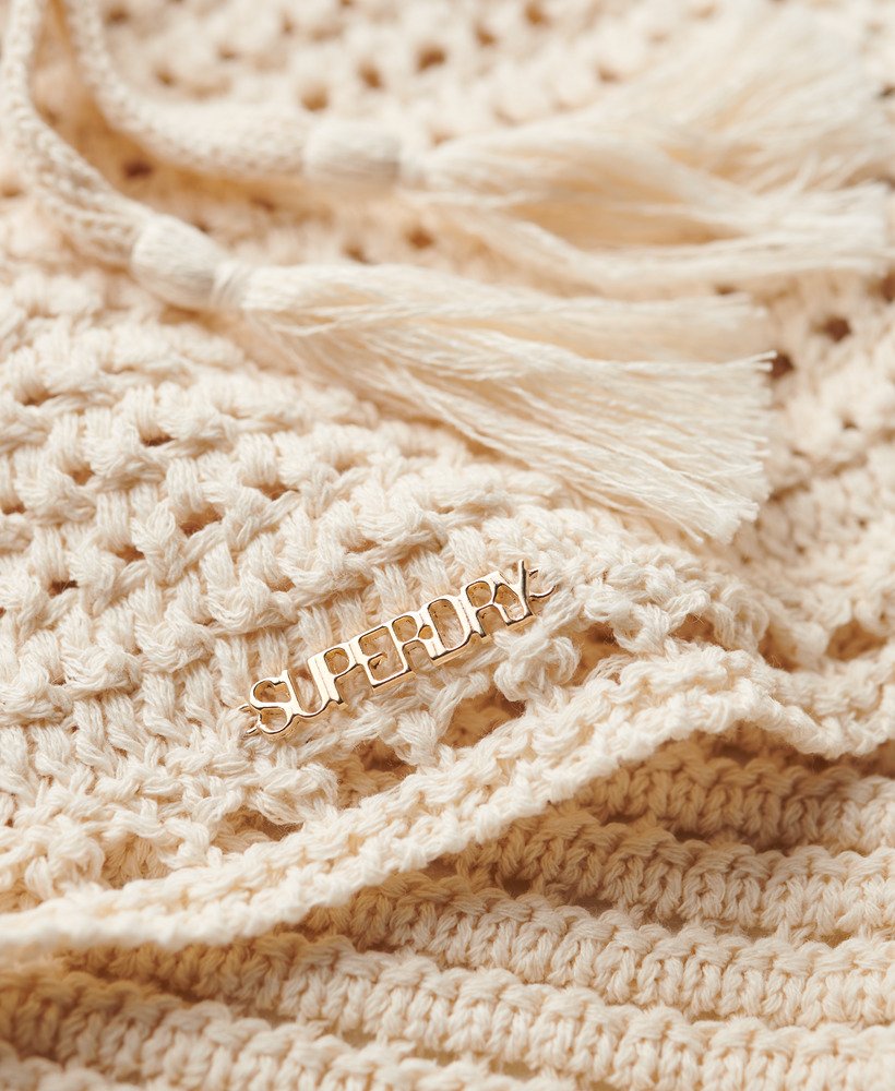 top cropped de crochê com decote halter na cor creme.