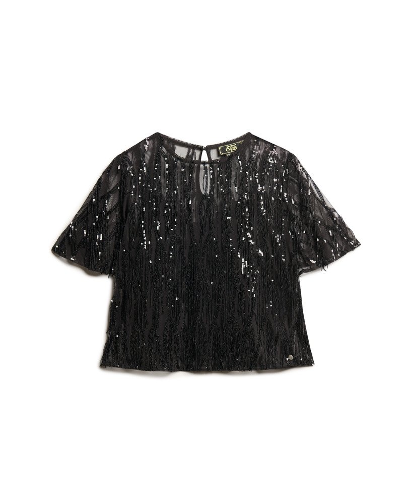 blusa transparente de manga curta com lantejoulas e franjas pretas.