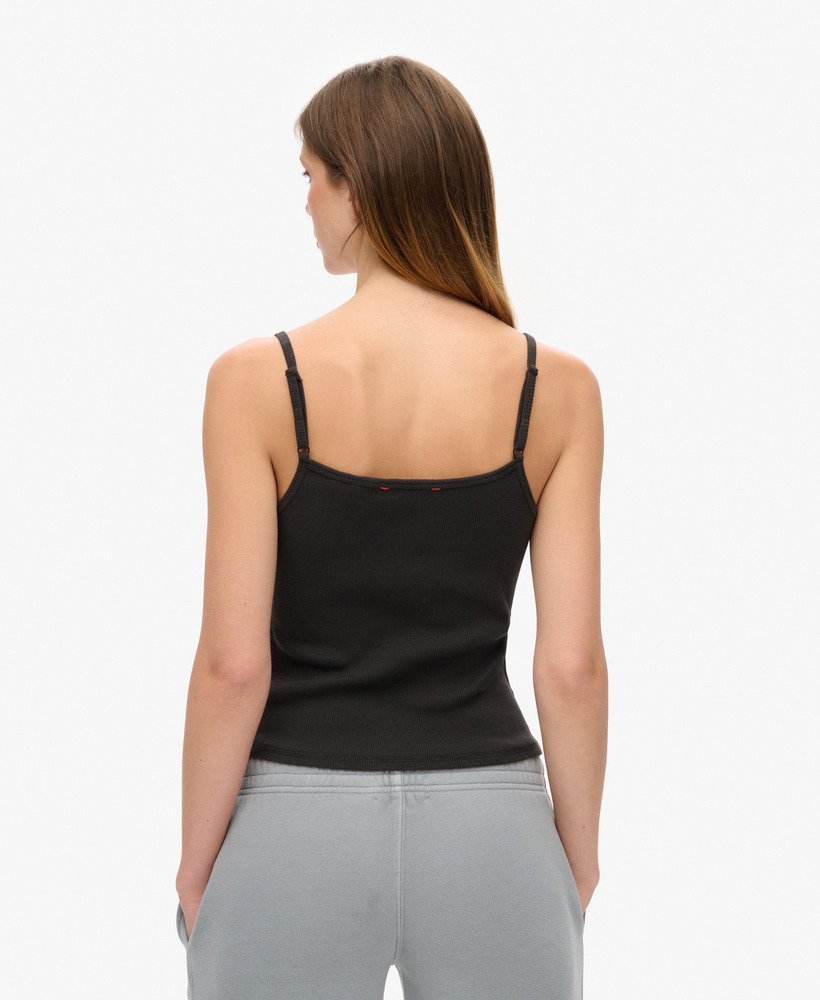 camiseta regata esportiva essencial com estampa de botões na cor bison black.