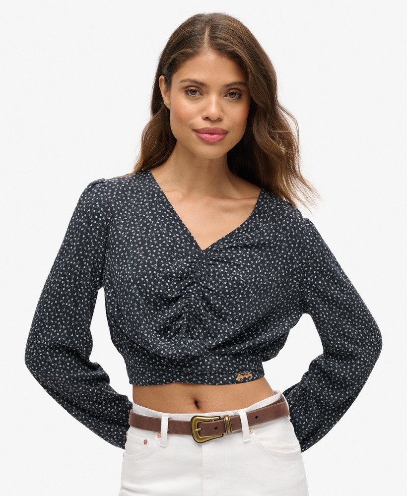 blusa vintage com amarração frontal em estampa floral miúda azul marinho