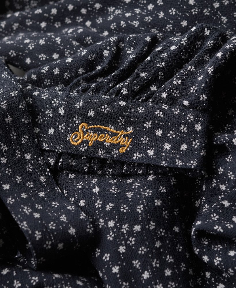 blusa vintage com amarração frontal em estampa floral miúda azul marinho