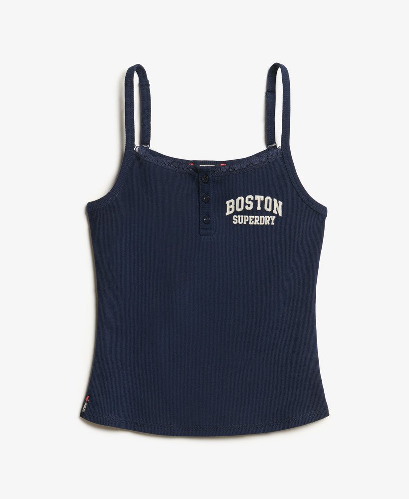 top regata athletic essentials com estampa e botões na cor azul marinho intenso.