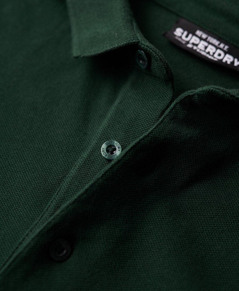 camisa polo de manga comprida em algodão piqué na cor verde-floresta.