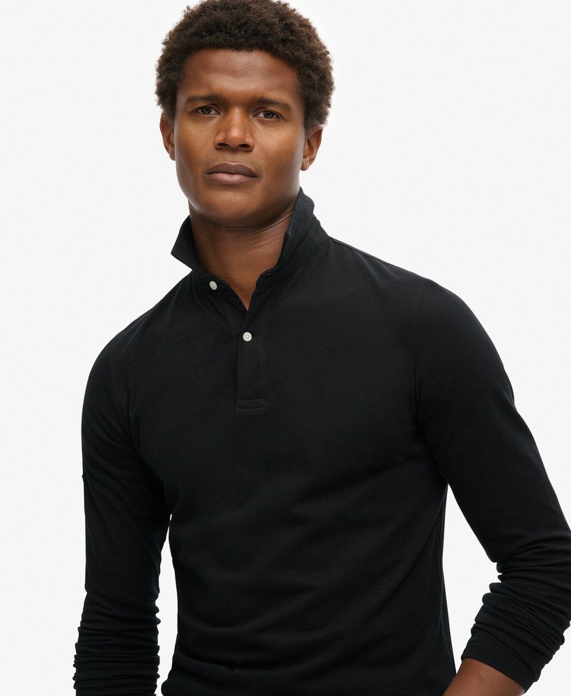 camisa polo de manga comprida studios em jersey na cor preta.