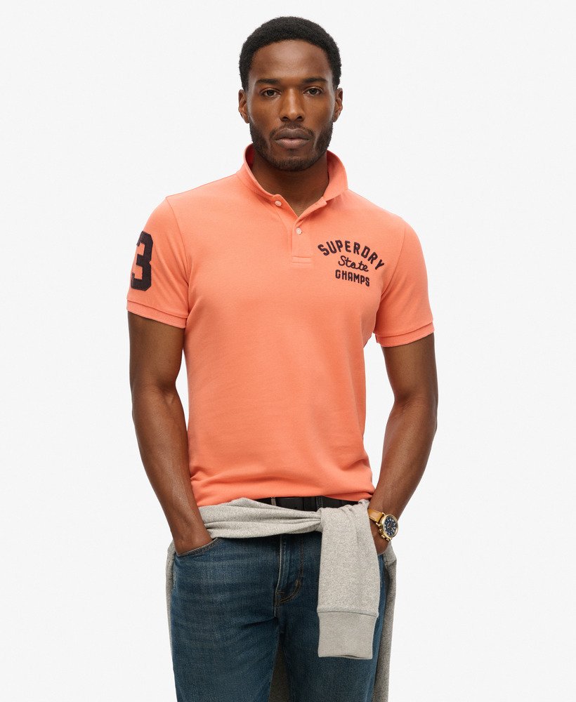 camisa polo superstate na cor coral sunburst.