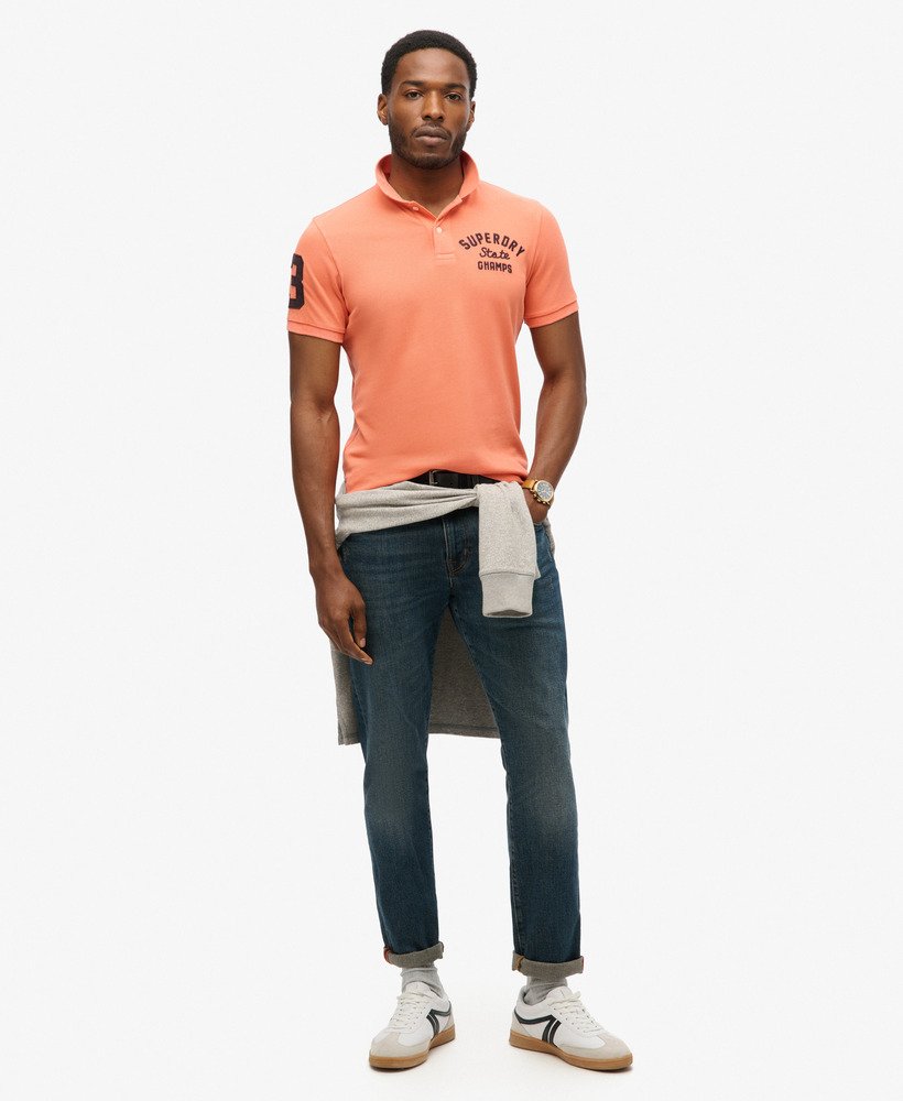 camisa polo superstate na cor coral sunburst.