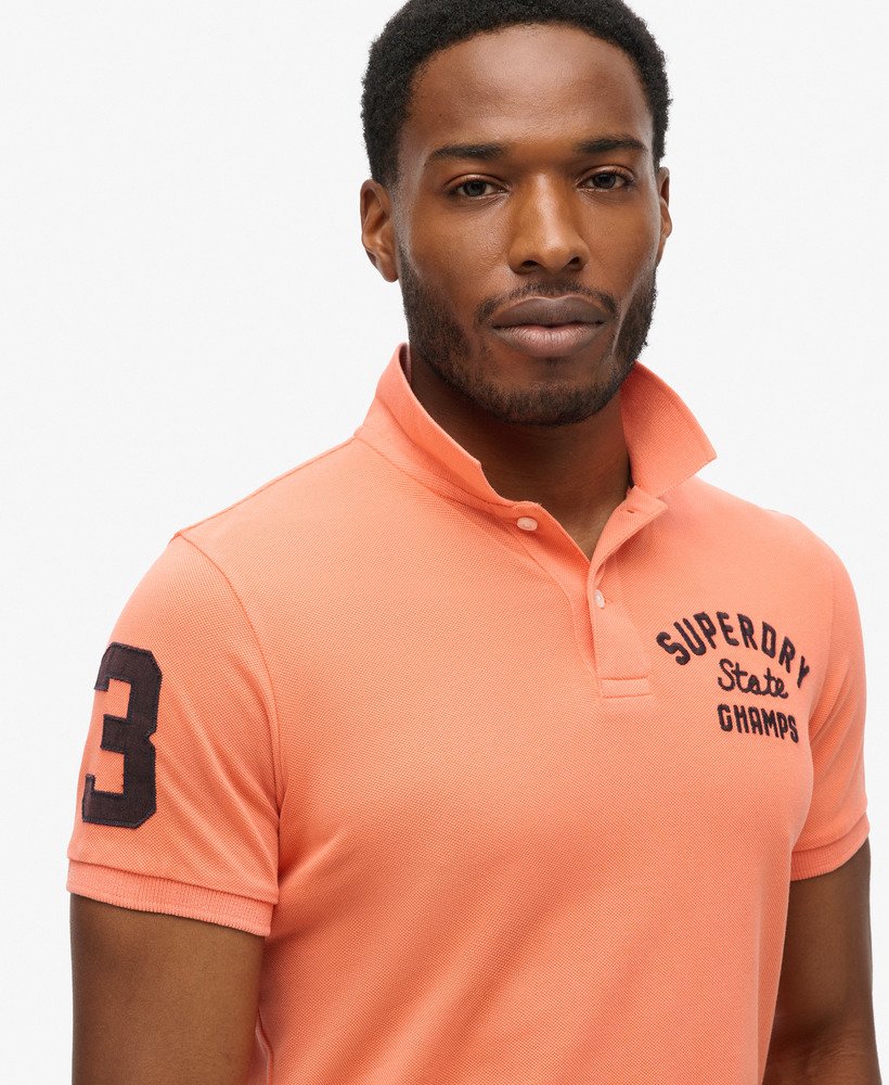 camisa polo superstate na cor coral sunburst.