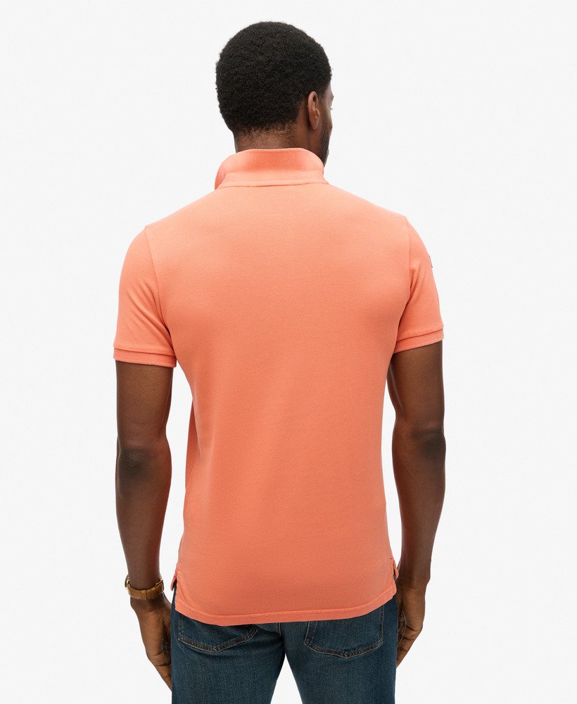 camisa polo superstate na cor coral sunburst.