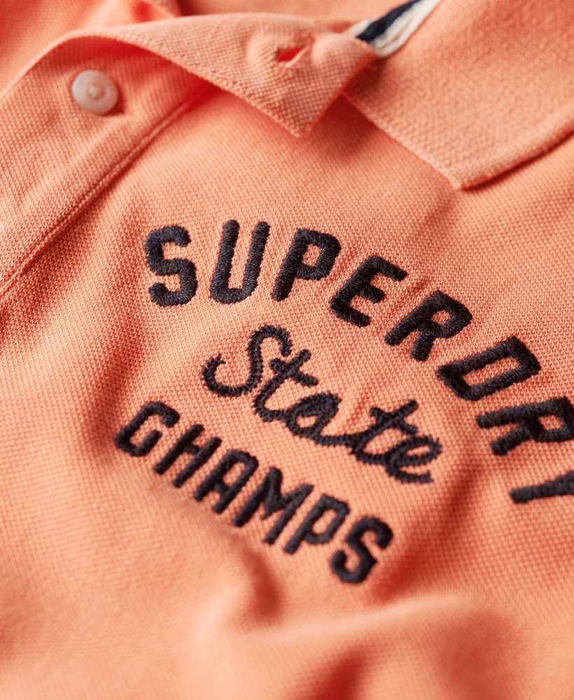camisa polo superstate na cor coral sunburst.
