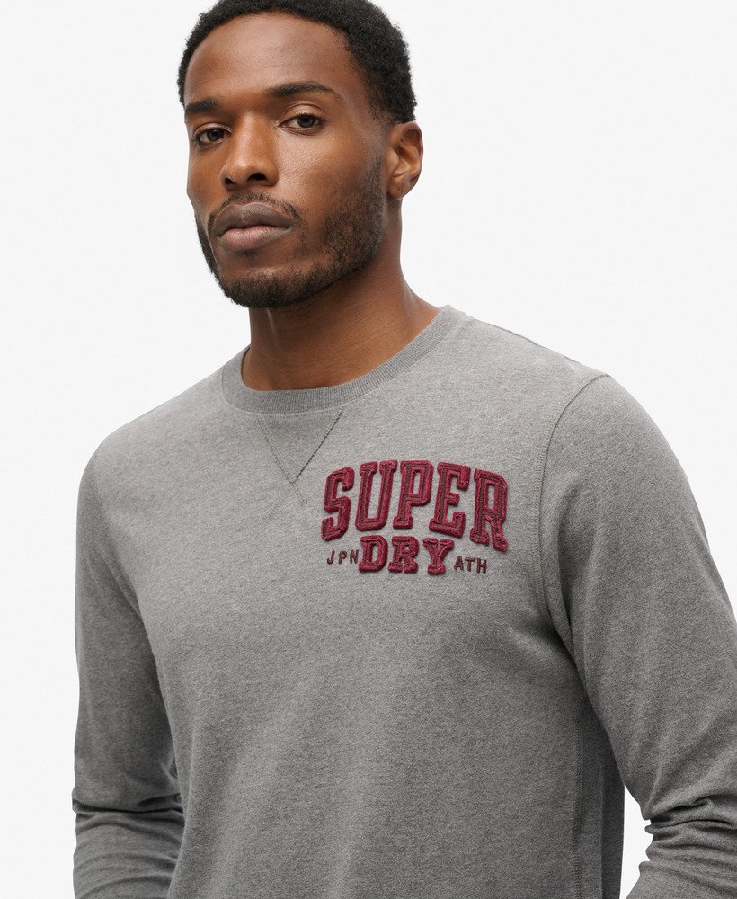 camiseta vintage esportiva de manga comprida na cor cinza mesclado médio.