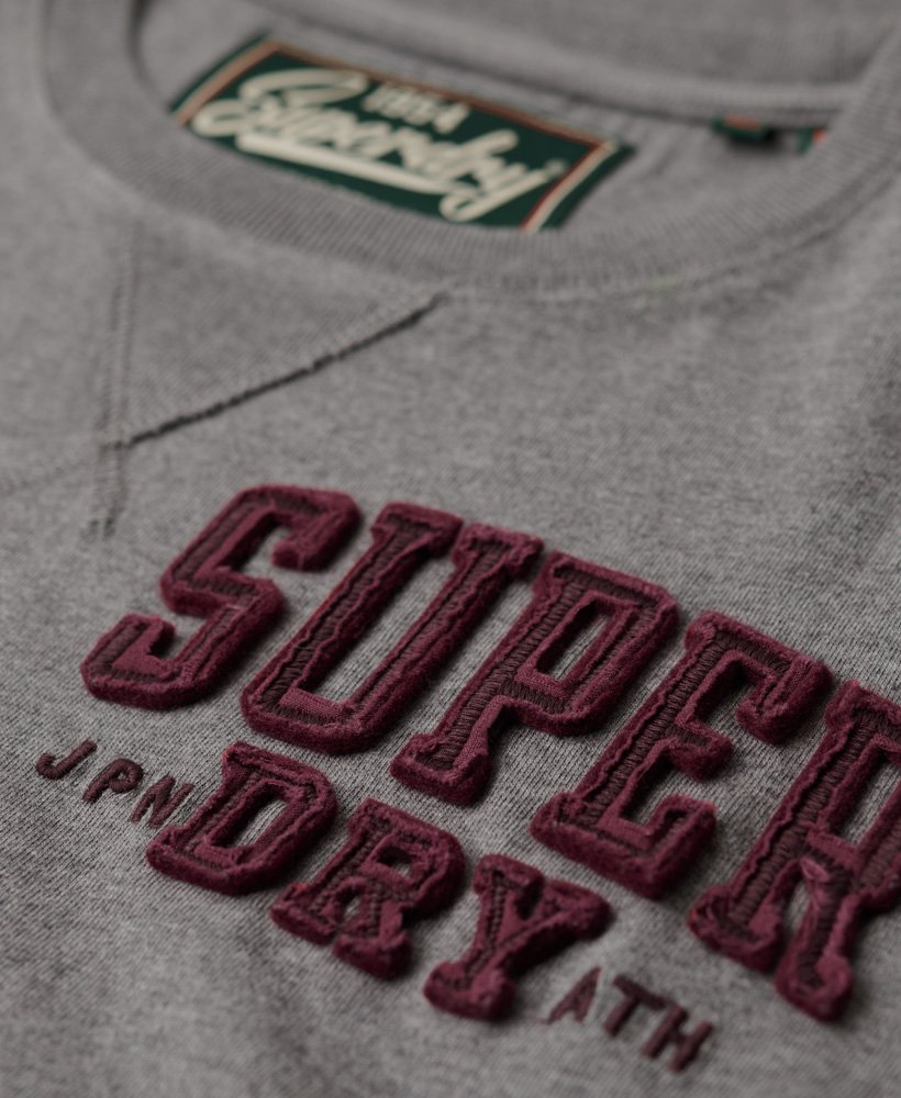 camiseta vintage esportiva de manga comprida na cor cinza mesclado médio.