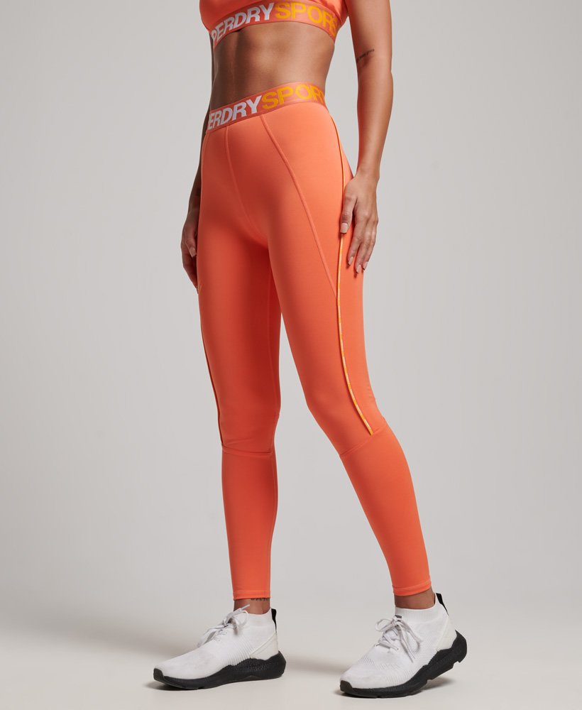 calça legging elástica justa da marca train na cor cali coral.