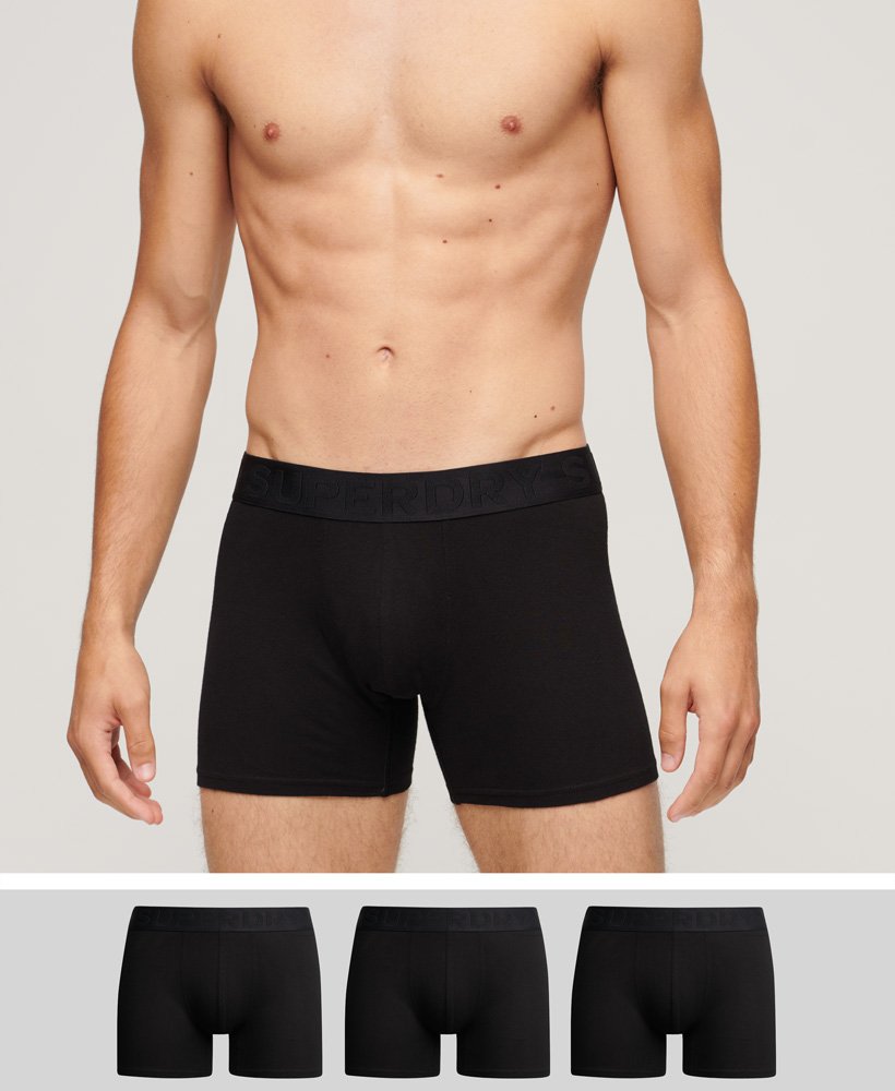 pacote com três cuecas boxer de algodão orgânico na cor preta.