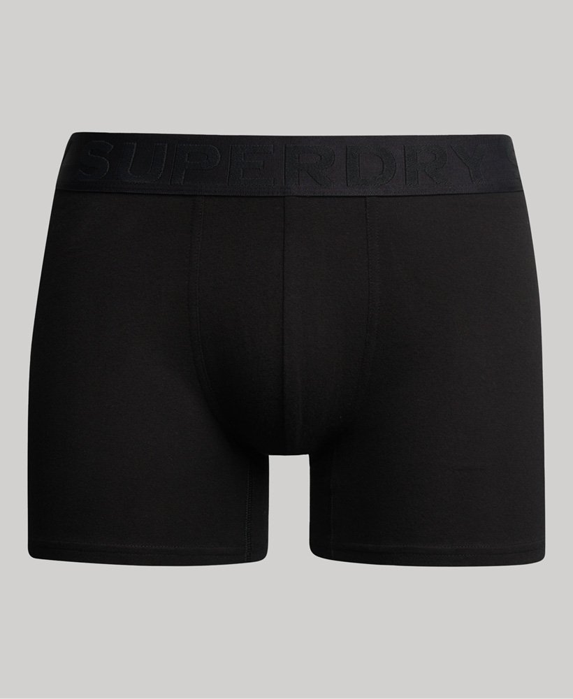 pacote com três cuecas boxer de algodão orgânico na cor preta.